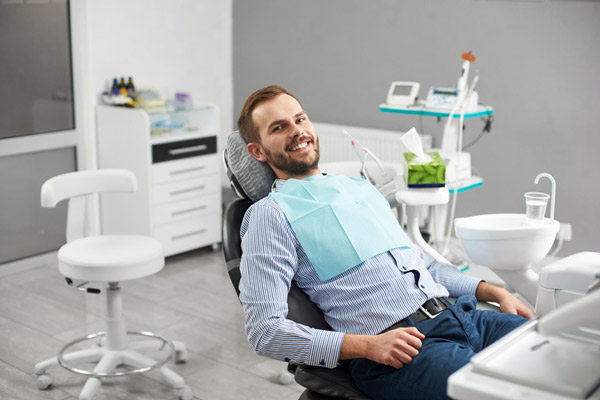 A man smiling after his deep cleaning at United Smile Centres in Louisville, KY