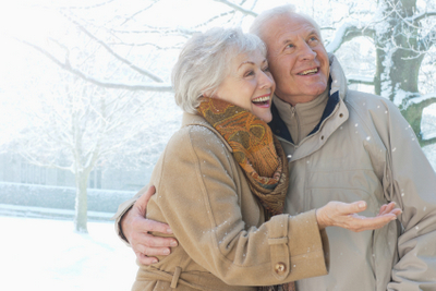 Elderly couple enjoying snow